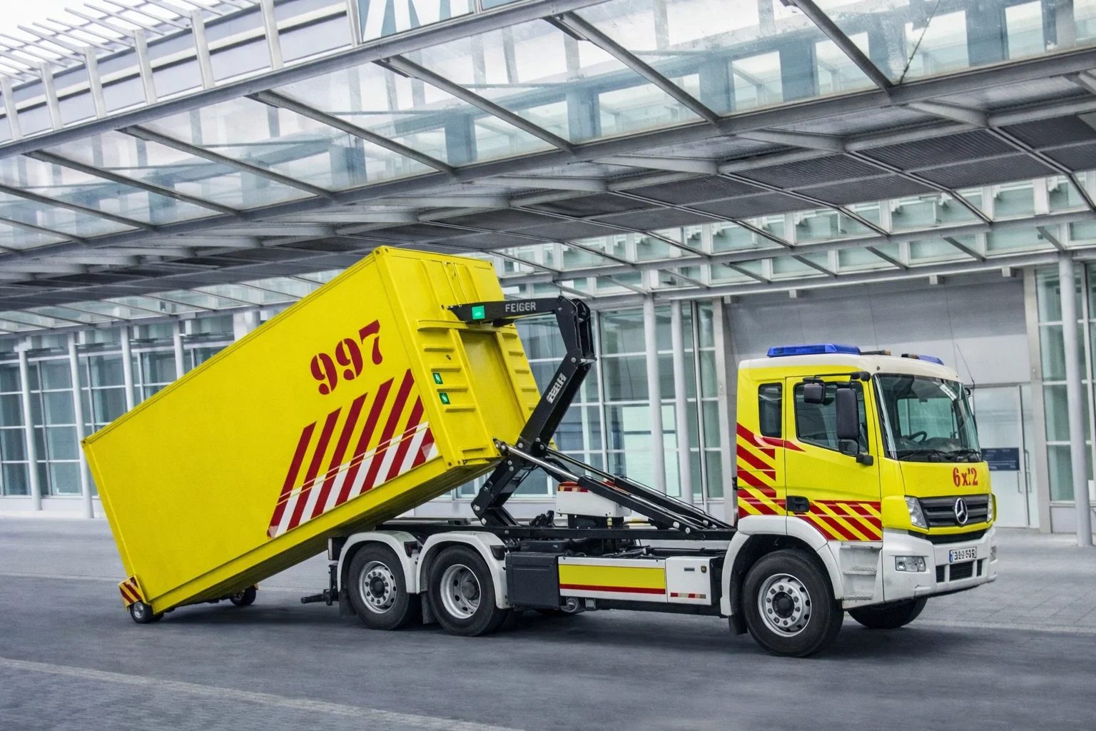 Fire and rescue MPSS container being loaded onto a hook-lift truck