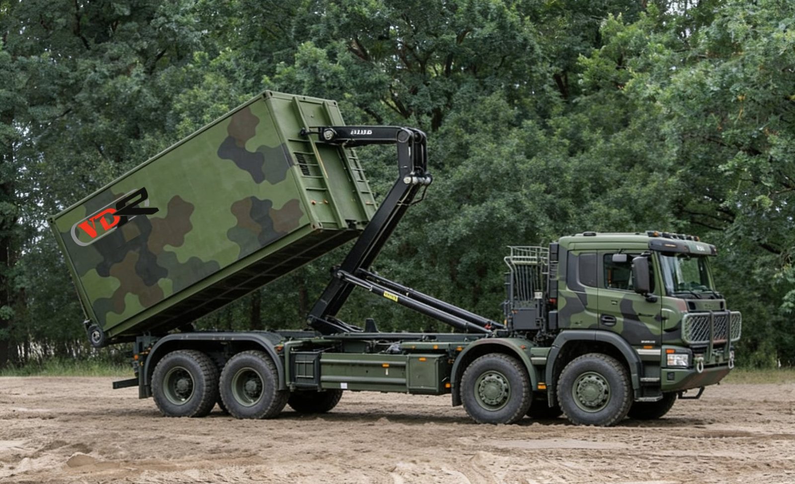 Camouflaged military MPSS container on an 8x8 hook-lift truck in a forest setting